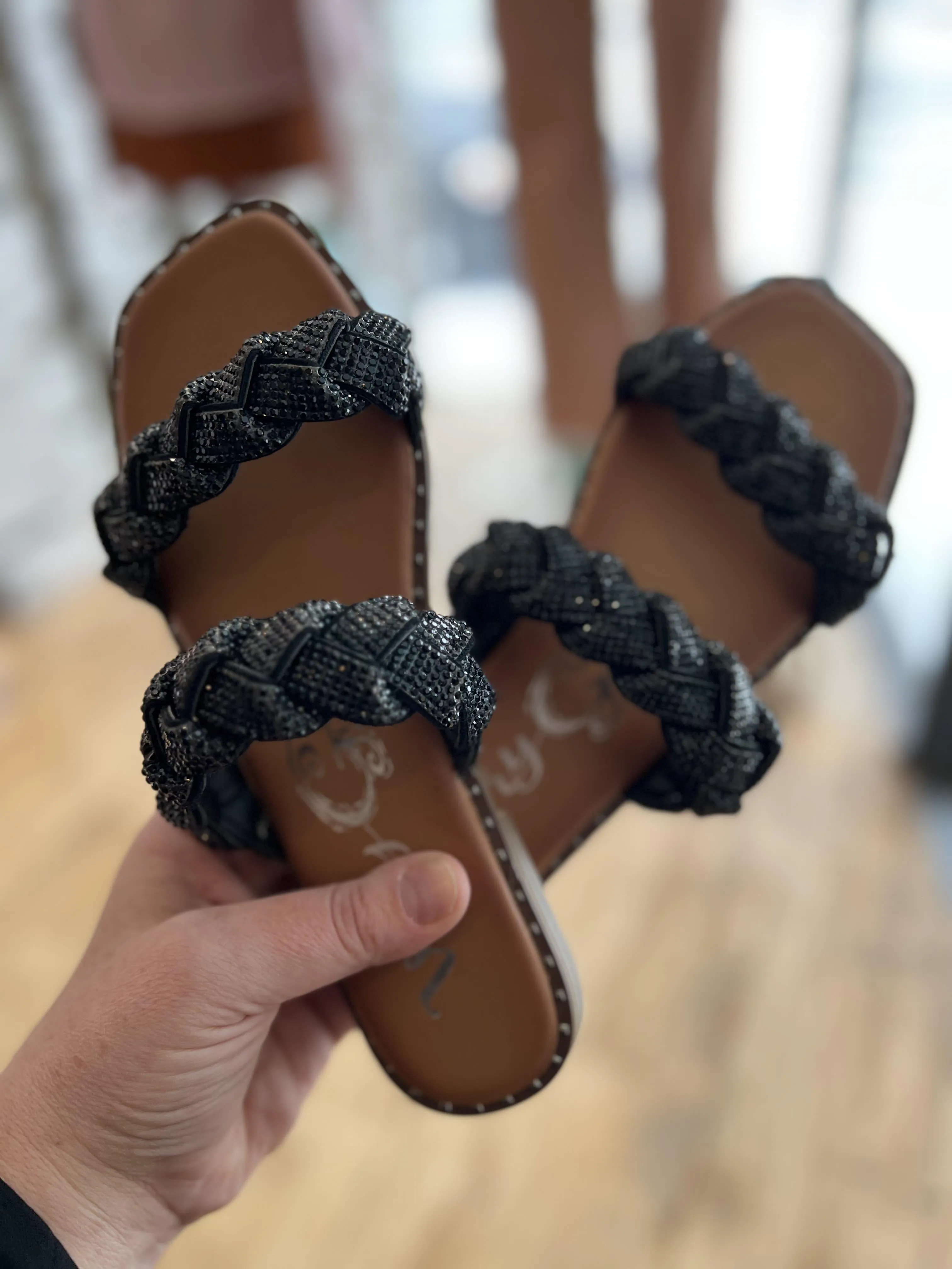 Twisty Black Flat Sandal